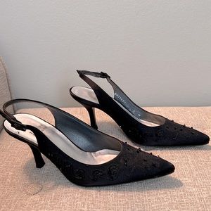 Gorgeous Stuart Weitzman pump. Black material with embroidery and beaded detail.